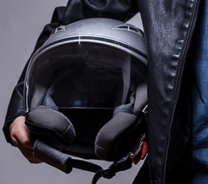 Colorado motorcycle driver holding a helmet